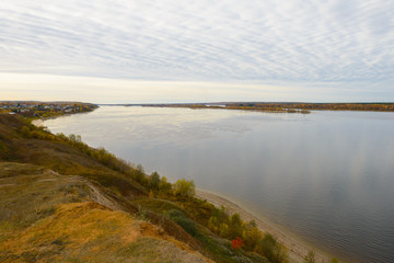 The Volga River on a cloudy autumn day. View from the high bank.