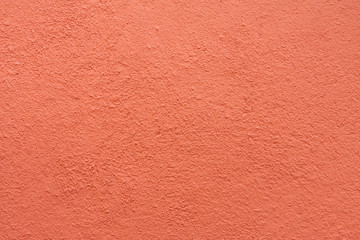 Stucco wall - Maroon red stucco textured wall background with natural light.
