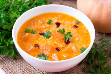 Pumpkin curry with pumpkin slices on a plate