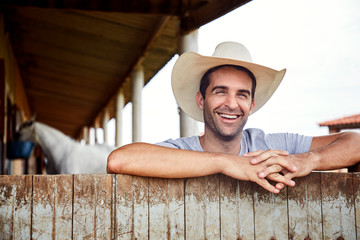 Happy cowboy guy smiling, portrait