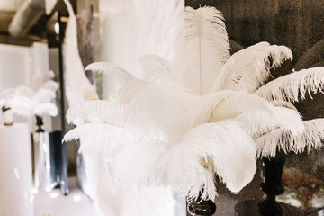 White ostrich feather wedding decoration of restaurant