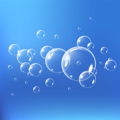Realistic soap bubbles set isolated on the blue background. vector Illustration