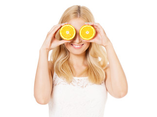 Portrait of happy woman with half orange. Beautiful girl holds piece of a cut orange in her hands and laughs, isolated on white background. Healthy lifestyle concept. 