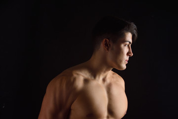 Fototapeta premium portrait of a man without clothes black background