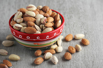 Mix of almond and pistachio in a ceramic bright bowl