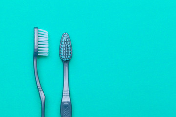 Flat lay composition with manual toothbrushes on color background, close up