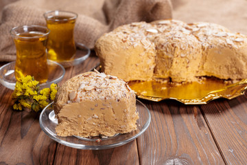 Tasty halva with tea on the table