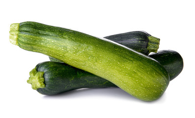 Fresh zucchinis on white background