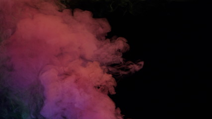 yellow and pink bomb smoke on black background