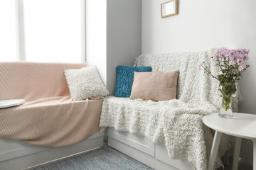 Cozy place for rest near window in light room