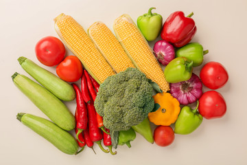 Different fresh vegetables on light background