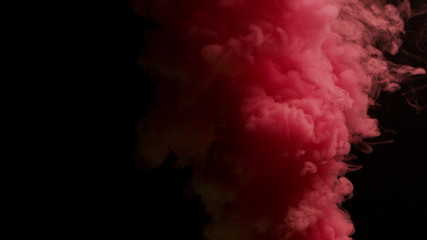 pink bomb smoke on black background