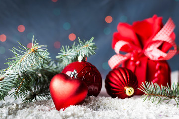 Fototapeta na wymiar Red Christmas ornaments with festive background