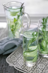 Glasses of fresh cucumber water on tray