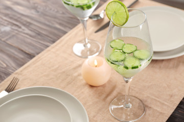 Glass of fresh cucumber water on dining table