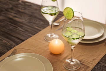 Glass of fresh cucumber water on dining table