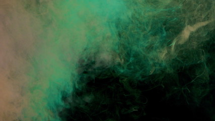 orange and green bomb smoke on black background
