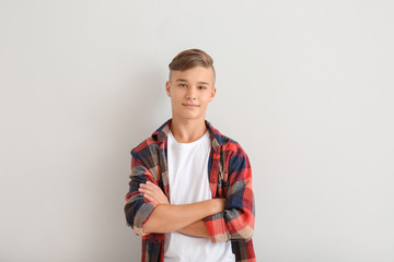Confident teenage boy on white background