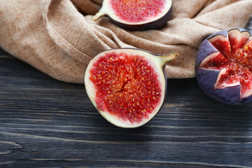 Cut ripe figs on wooden table