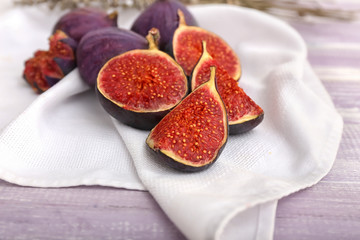Fresh ripe figs on wooden table