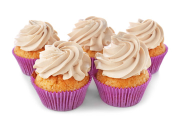 Delicious cupcakes on white background