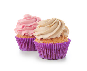 Delicious cupcakes on white background