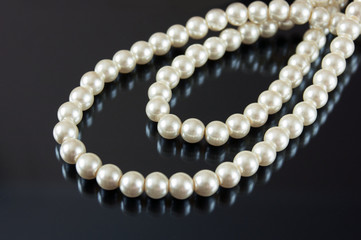 pearls necklace on black background