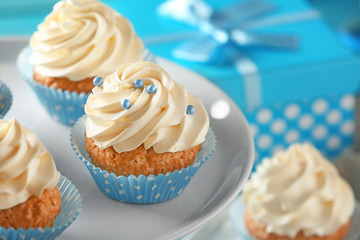 Stand with delicious cupcakes, closeup