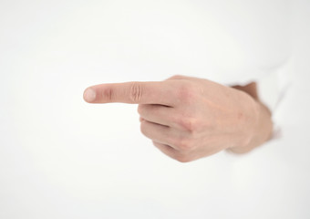 man's hand breaking through the paper wall and pointing at you