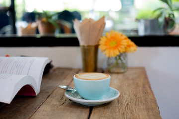 Latte arts coffe hot coffee on wooden table.barista art concept.