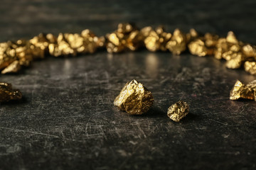Gold nuggets on black background