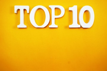 top ten letters alphabet with space copy on yellow background