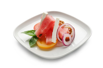 Plate with delicious watermelon salad on white background