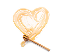 Heart drawn with honey on white background