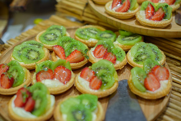 pastries with fruit and cream on a buffet