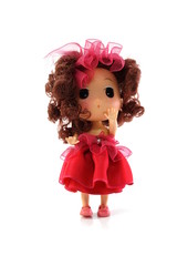 beautiful baby doll with red dress isolated on white background