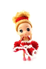 beautiful baby doll with red dress isolated on white background