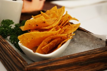 nachos chips with tomato salsa and guacamole