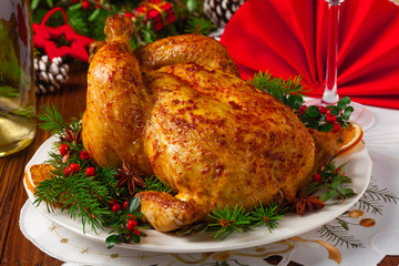 Roasted whole chicken with Christmas decoration.