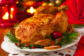 Roasted whole chicken with Christmas decoration.