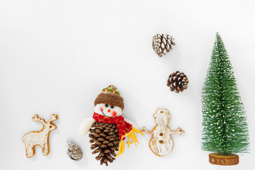 Christmas and New year background. Christmas tree and pine cones with decoration on white paper. Creative flat lay , top view design