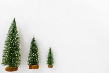 Christmas trees isolated on white background. Creative flat lay, top view design