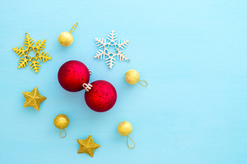 Christmas composition. Christmas balls, star and snowflake on blue background. Creative flat lay, top view design