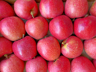fresh juicy red apples top view closeup, natural background