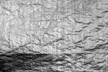 Crumpled transparent plastic  surface in black and white.