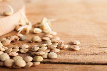 Lentils on wooden table close up