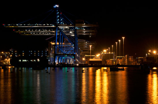 Birzebugga, Malta, 9 dec, 2017:  Malta freeport on night time with beautifull reflections on a water