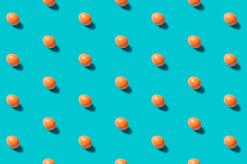 Eggs pattern on a blue background flat lay. Top view. Concept.