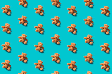 Teddy bear pattern on a blue background flat lay