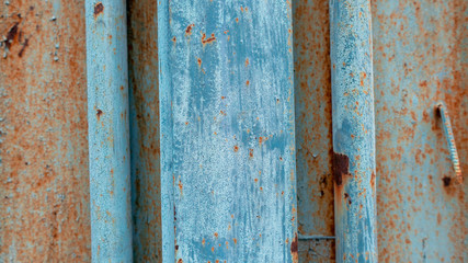 Rusty texture on a metal container that is on the street all year round.